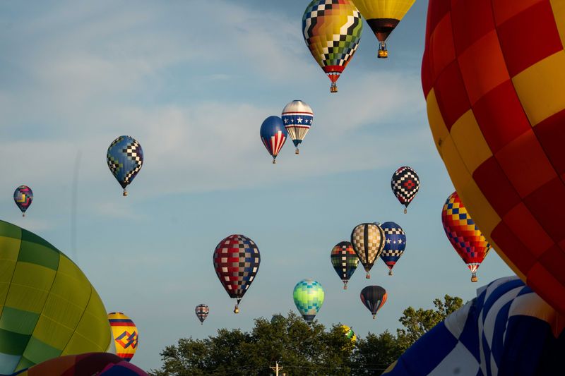 Hot air balloons take to the skies during the 2024 National Balloon Classic on Thursday, Aug. 1, 2024, in Indianola.