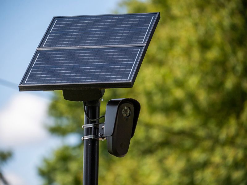 A Flock camera is positioned on a pole along State Road 46 west of Ellettsville on Thursday, Aug. 8, 2024.