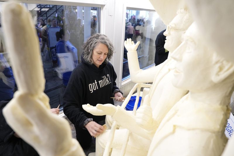 The butter cow was joined by an ode to the Iowa State Fair's Sky Glider and late-night comedians at the Ag Building at the Iowa State Fair in Des Moines on Aug. 9, 2024. In 2006, after 15 years of apprenticing, Sarah Pratt of West Des Moines became the fair's fifth butter sculptor.