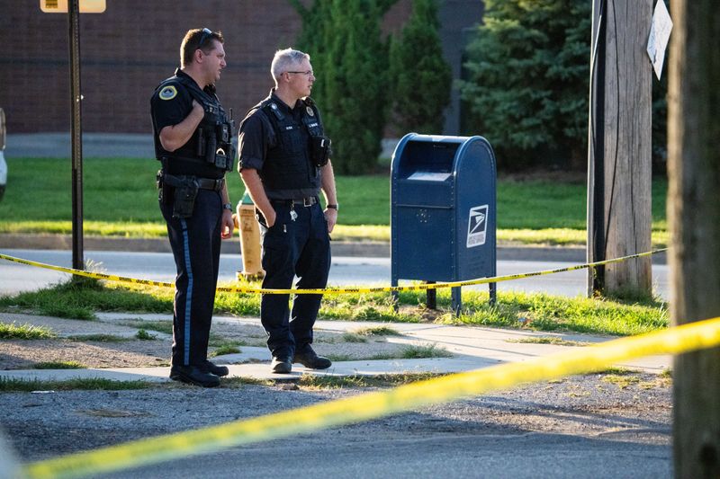 Police investigate a crime scene where two Des Moines police officers were shot and a suspect was killed on Monday, Sept. 16, 2024.
