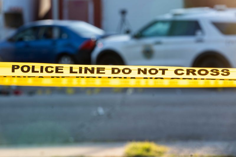 Police investigate a crime scene where two Des Moines police officers were shot and a suspect was killed on Monday, Sept. 16, 2024.