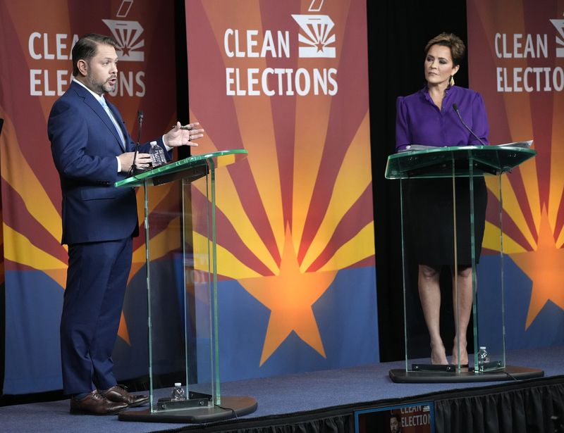Arizona Senate candidates Rep. Ruben Gallego, D-Ariz., and Kari Lake answer questions during the Arizona Clean Election Commission debate at BitFire Studios on Oct. 9, 2024.