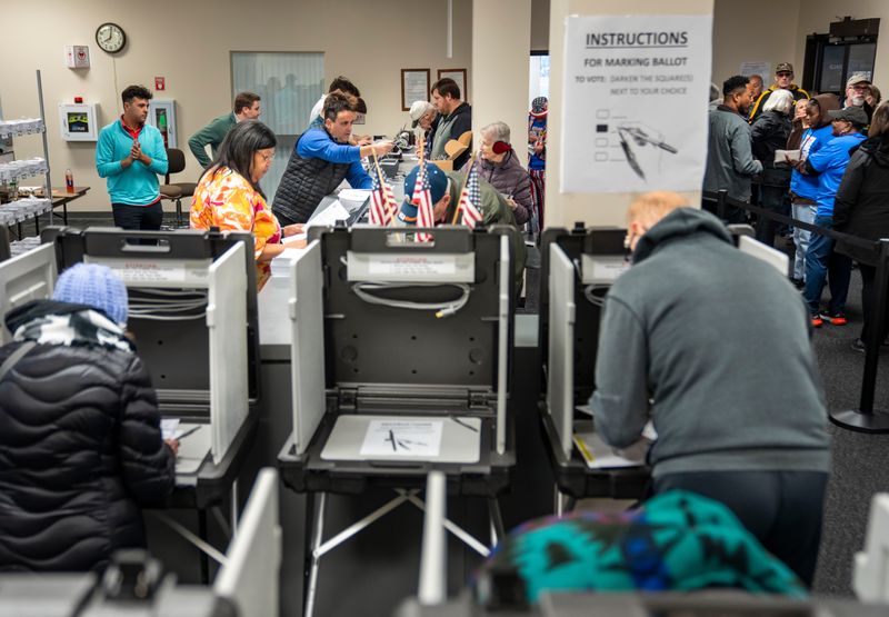 Voters pack the Polk County Election Office in Des Moines to cast their ballots on the first day of early voting, Wednesday, Oct. 16, 2024. Early voting for the 2025 city and school elections starts Oct. 15.