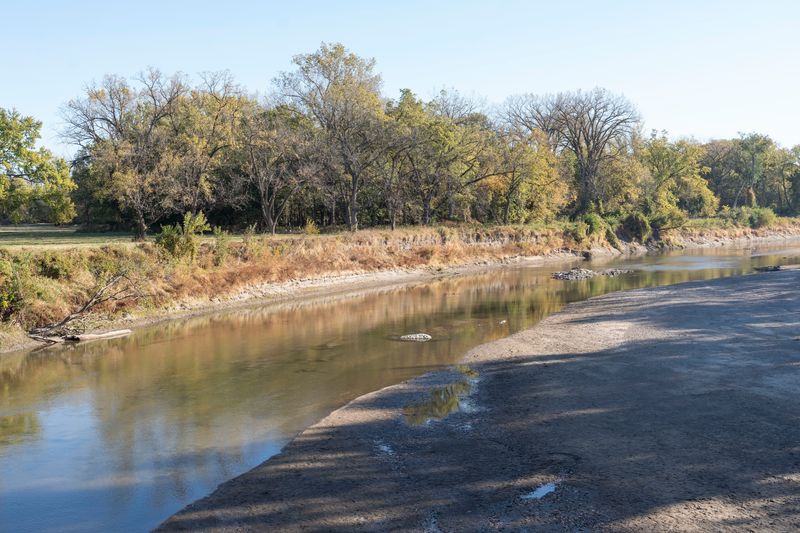 Fall colors are seen along the Raccoon River in Water Works Park on Thursday, Oct. 17, 2024, in Des Moines.