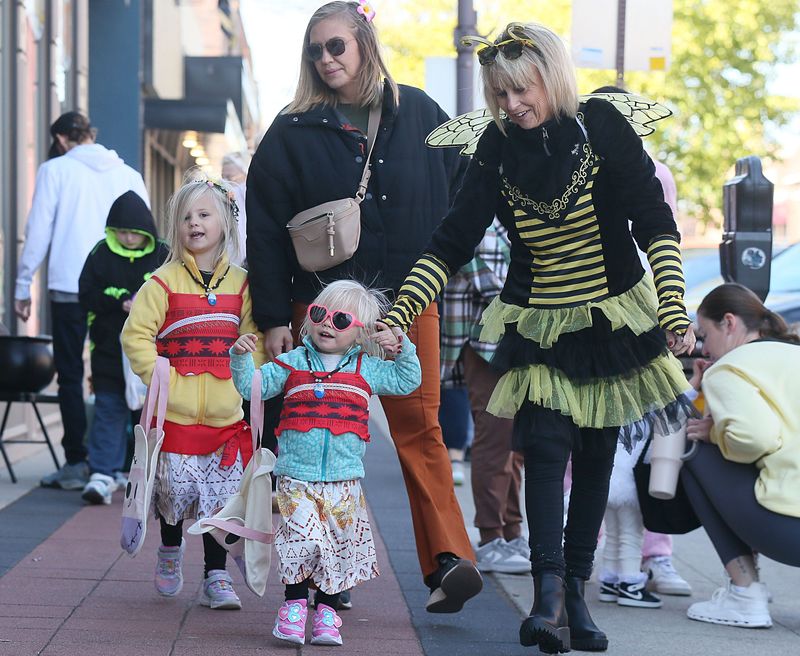 Stevie Care, 6,and Frankee Carr, 2, wear Halloween costumes during the Ames downtown trick-or-treat event Friday, Oct. 25, 2024, in Ames, Iowa.