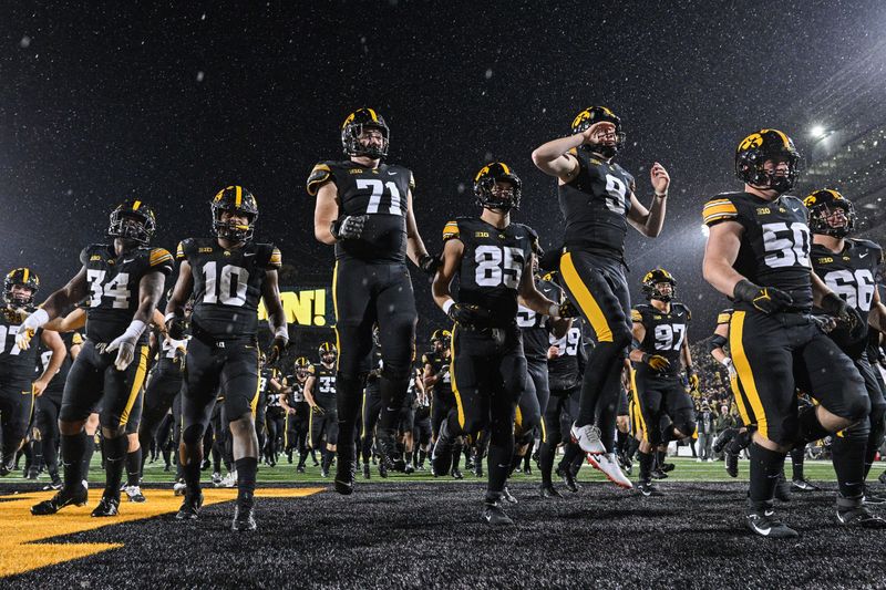 Nov 2, 2024; Iowa City, Iowa, USA; The Iowa Hawkeyes react after the game against the Wisconsin Badgers at Kinnick Stadium. Mandatory Credit: Jeffrey Becker-Imagn Images