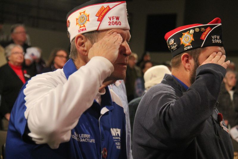 VFW/American Legion members salute the flag during the Veterans Day program on Monday, Nov. 11, 2024, at Perry Performing Arts Center.
