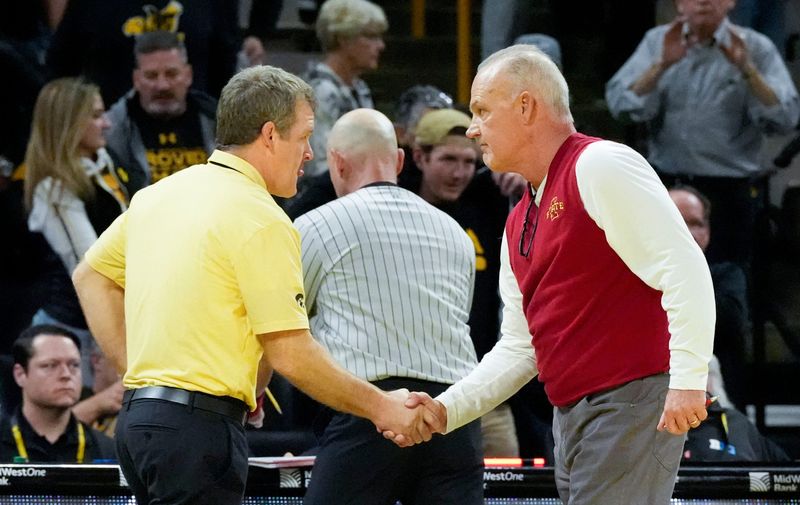 Iowa head coach Tom Brands shakes Iowa State head coach Kevin Dresser’s hand after the Cy-Hawk wrestling dual Saturday, Nov. 23, 2024 at Carver-Hawkeye Arena in Iowa City, Iowa.