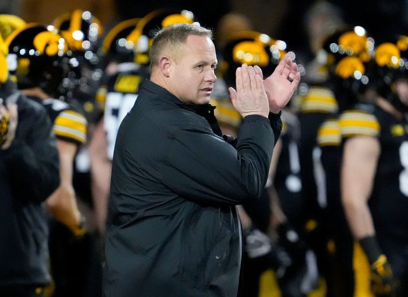 Iowa Hawkeyes assistant head coach Seth Wallace watches warmups before the football game against the Nebraska Cornhuskers Friday, Nov. 29, 2024 at Kinnick Stadium in Iowa City, Iowa.