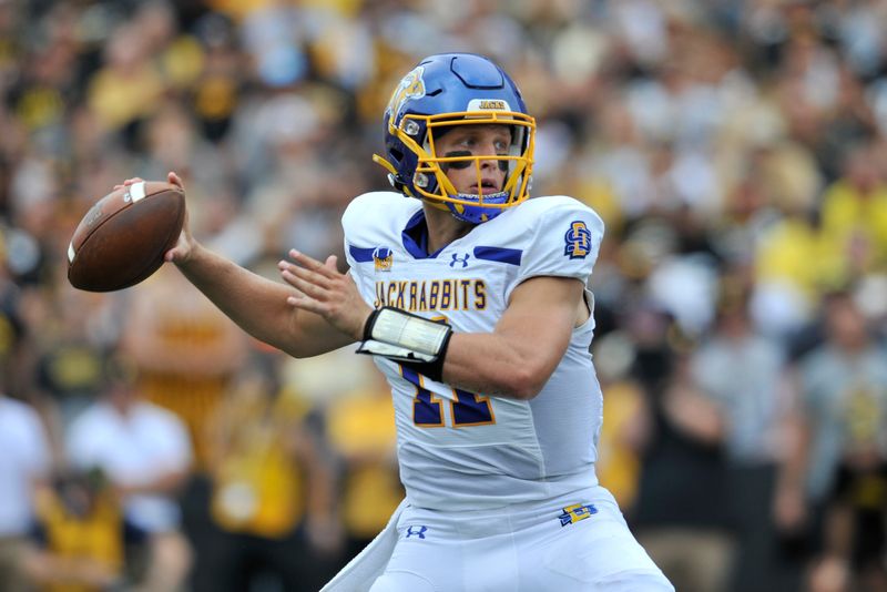 Sep 3, 2022; Iowa City, Iowa, USA; South Dakota State Jackrabbits quarterback Mark Gronowski (11) throws a pass against the Iowa Hawkeyes during the second quarter at Kinnick Stadium. Mandatory Credit: Jeffrey Becker-USA TODAY Sports