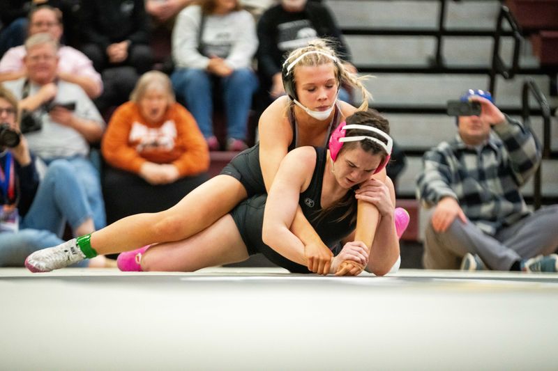 Ankeny's Hayden Bratland wrestles Raccoon River's Bethann Templeman on Tuesday, Jan. 7, 2025, at Northview Middle School in Ankeny.