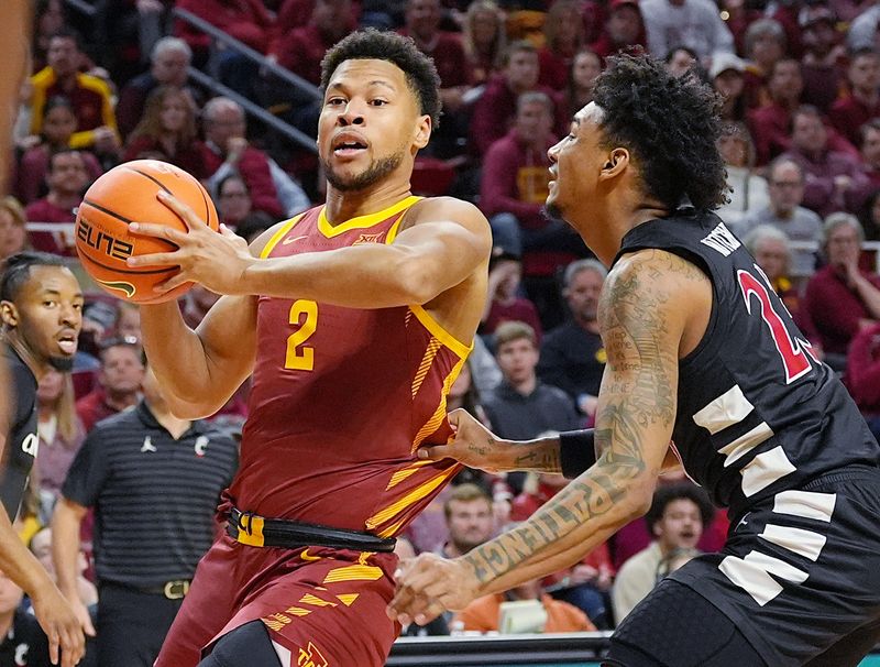 Iowa State Cyclones forward Joshua Jefferson (2) drives to the basket around Cincinnati Bearcats' forward Dillon Mitchell (23) during the first half in the Big-12 men’s basketball at Hilton Coliseum on Feb. 15, 2025 in Ames, Iowa.