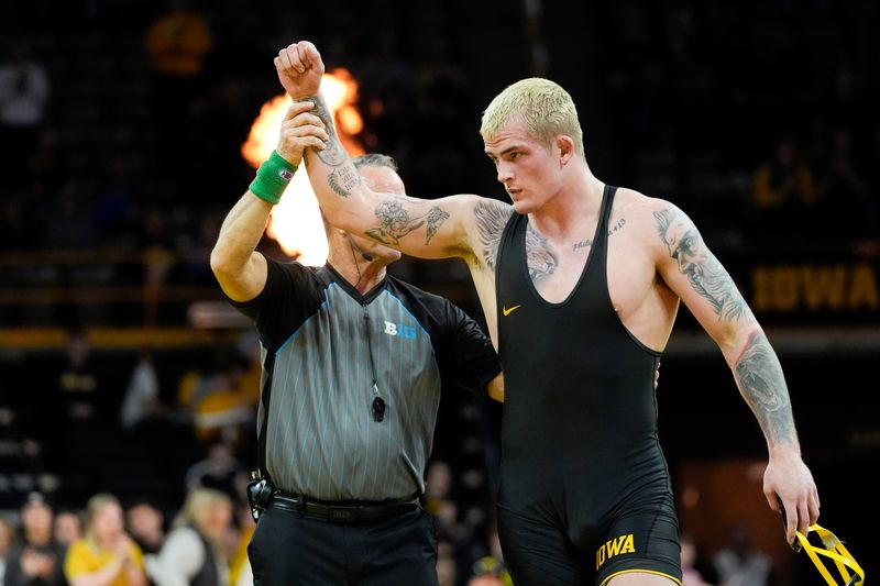 Iowa’s Ben Kueter defeated Northwestern's Dirk Morley in a 285-pound match during a Big Ten conference dual Sunday, Feb. 16, 2025 at Carver-Hawkeye Arena in Iowa City, Iowa.