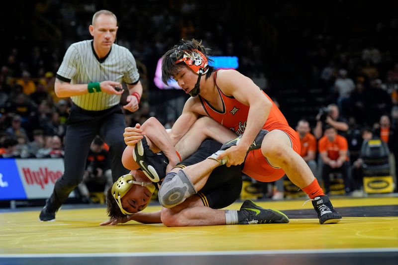 Iowa’s Drake Ayala wrestles Oklahoma State's Rin Sakamoto in a 133-pound match Sunday, Feb. 23, 2025 at Carver-Hawkeye Arena in Iowa City, Iowa.