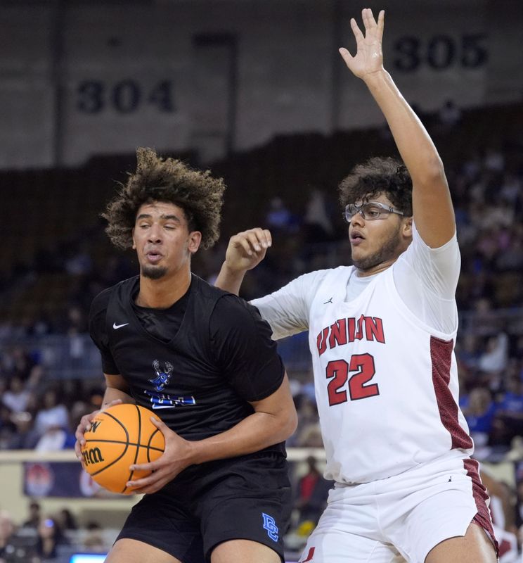 Deer Creek's Phoenix Woodson (23) looks to pass as Tulsa Union's Miles Flemons (22) defend during the Class 6A boys high school state basketball championship game between Deer Creek and Tulsa Union at State Fair Arena in Oklahoma City, Saturday, March 15, 2025.