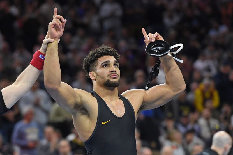 Mar 22, 2025; Philadelphia, PA, USA; Stephen Buchanan of the Iowa Hawkeyes celebrates win over Josh Barr of the Penn State Nittany Lions (not pictured) during the Division I Men's Wrestling Championship held at Wells Fargo Center. Mandatory Credit: Eric Hartline-Imagn Images