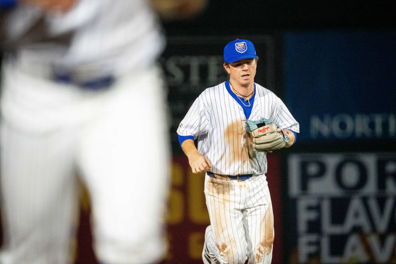 Iowa Cubs' James Triantos (4) returns to the dugout during the season opener against Omaha on Friday, March 28, 2025, at Principal Park in Des Moines.