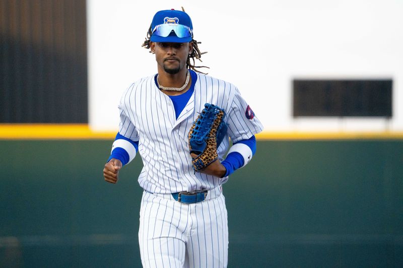 Iowa Cubs' Kevin Alcantara (9) runs to the dugout during opening day against the Omaha Storm Chasers on Friday, March 28, 2025, at Principal Park in Des Moines.