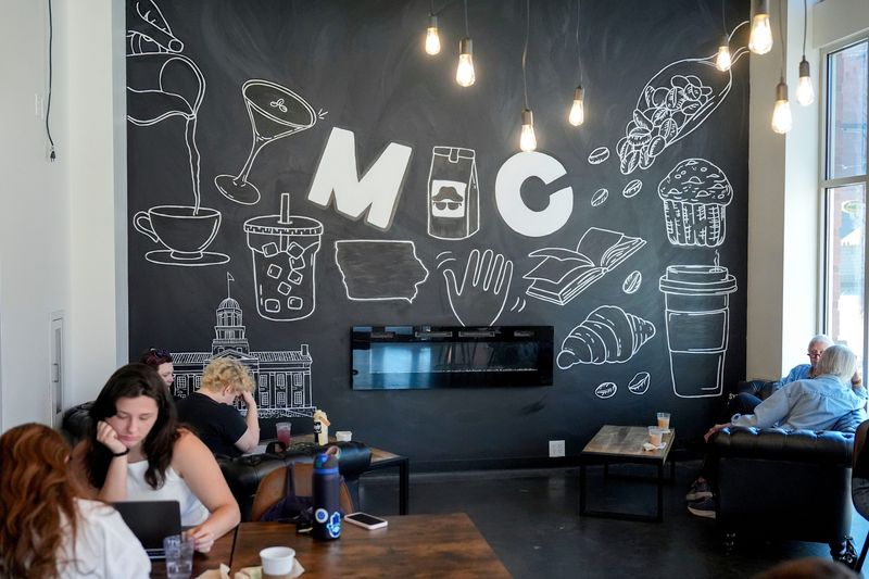 Customers lounge inside Midnight Coffee on Friday, March 28, 2025, in downtown Iowa City, Iowa.