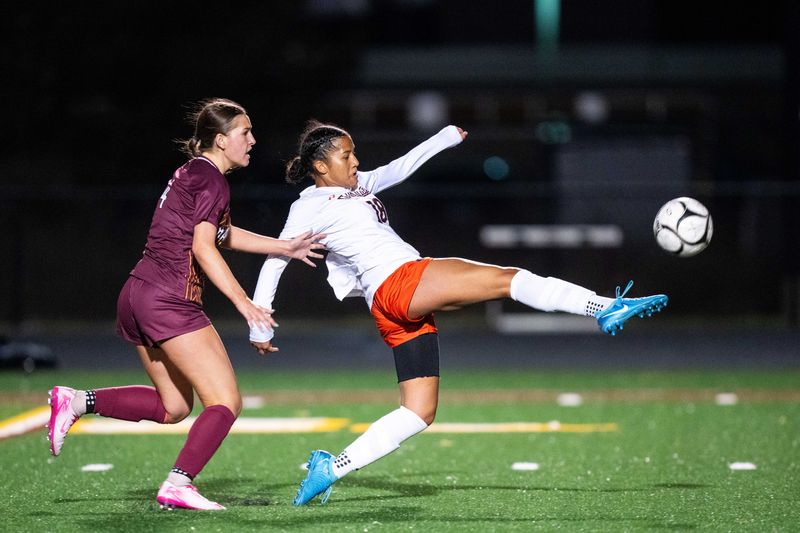 Valley's Olivia Rotich (18) takes a shot at the goal during a game against Ankeny on Tuesday, April 8, 2025, at Ankeny High School.