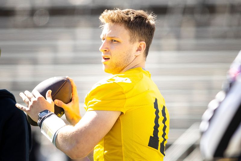 Apr 26, 2025; Iowa City, IA, USA; Iowa quarterback Mark Gronowski (11) throws during a spring NCAA football open practice at Kinnick Stadium. Mandatory Credit: Joseph Cress/For the Register