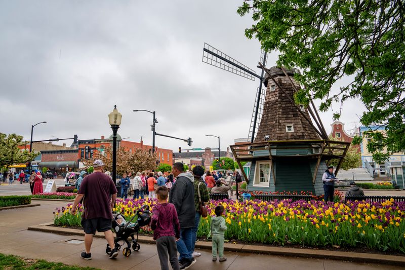 Visitors stroll though Central Park during Pella's Tulip Time festival, Thursday, May 1, 2025.