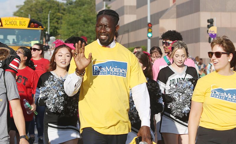 Des Moines School District superintendent Dr. Ian Roberts waves to the crowd as passing through Grand Avenue during the Iowa State Fair Parade on August 9, 2023, in Des Moines, Iowa.