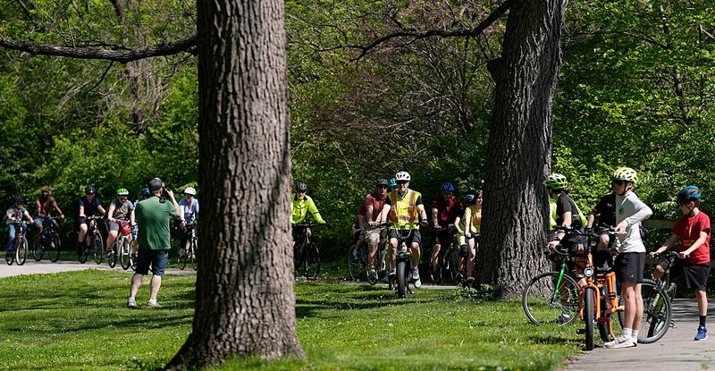 Ames Mayor John Haila leads the bike ride through the Brookside Park during the 10-mile bike ride around Ames in the annual Mayor and City Council’s Bike Ride on May 10, 2025, in Ames, Iowa.