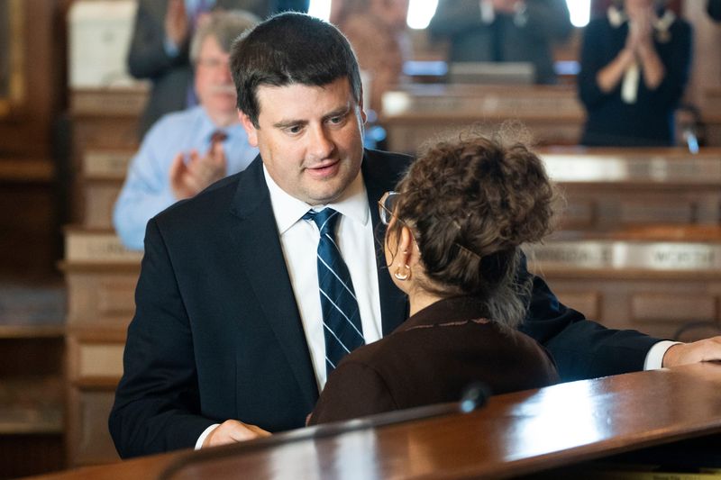 Rep. Angel Ramirez talks with Speaker Pat Grassley during her swearing-in ceremony at the Iowa State Capitol on May 13, 2025, in Des Moines.
