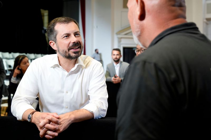 Former U.S. Secretary of Transportation Pete Buttigieg shakes hands after a town hall hosted by VoteVets May 13, 2025 in Cedar Rapids, Iowa.