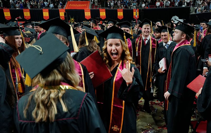 Iowa State University graduates celebrate after receiving their diplomas during the university Spring Commencement Ceremony at Hilton Coliseum, May 17, 2025, in Ames, Iowa.