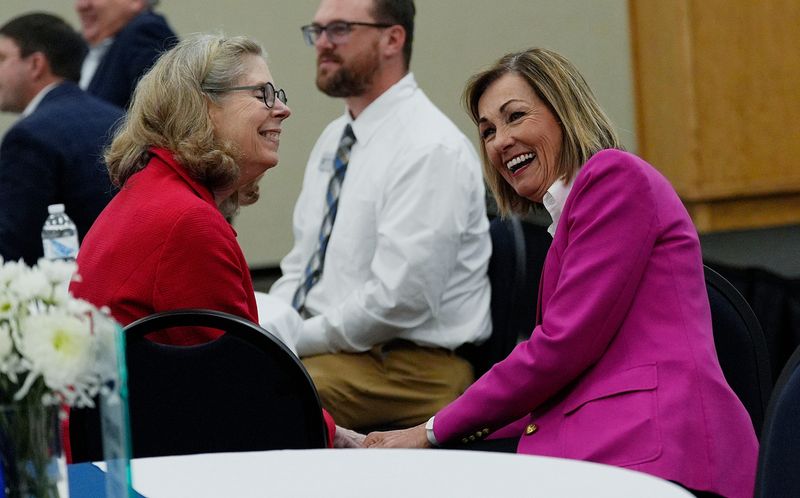 Iowa Gov. Kim Reynolds talks to Iowa State University president Wendy Wintersteen during the Daisy Brand groundbreaking ceremony on May 20, 2025, in Boone, Iowa.