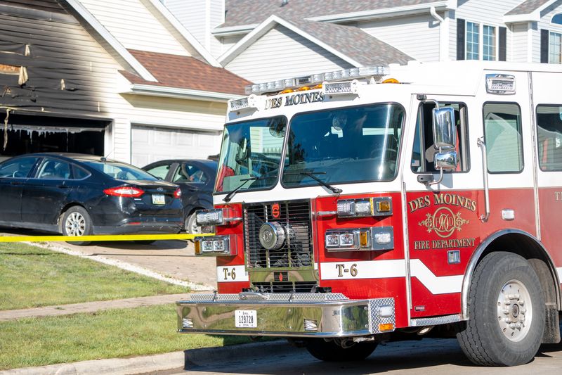 The Des Moines Fire Department responds to a house fire at the 6700 block of Three Lakes Parkway on May 21, 2025, in Des Moines.
