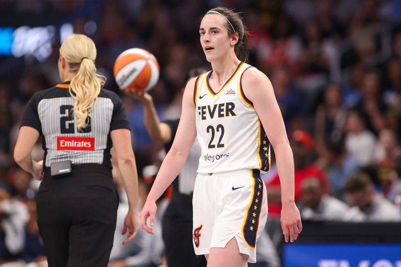 May 22, 2025; Atlanta, Georgia, USA; Indiana Fever guard Caitlin Clark (22) in action against the Atlanta Dream in the first half at State Farm Arena. Mandatory Credit: Brett Davis-Imagn Images