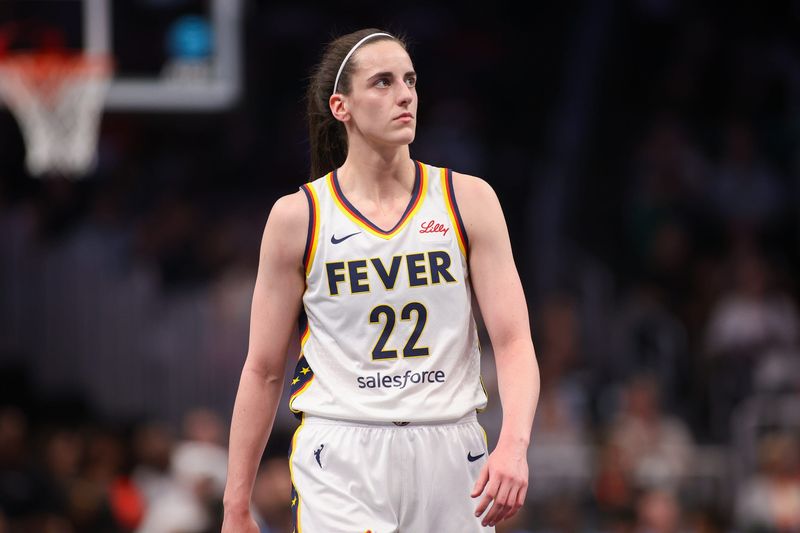 May 22, 2025; Atlanta, Georgia, USA; Indiana Fever guard Caitlin Clark (22) in action against the Atlanta Dream in the first half at State Farm Arena. Mandatory Credit: Brett Davis-Imagn Images