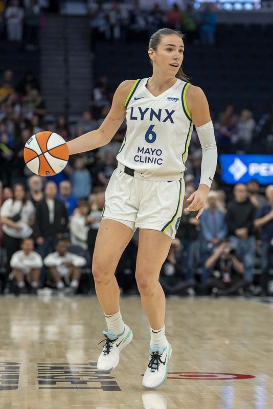 Minnesota Lynx forward Bridget Carleton (6) dribbles the ball against the Connecticut Sun in the first half of a game on May 23, 2025, at the Target Center in Minneapolis.
