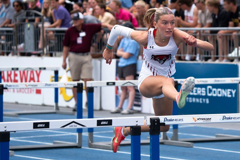 ADM's Elise Coghlan competes in the 3A shuttle hurdle relay final during the 2025 Iowa high school state track and field meet at Drake Stadium on May 24, 2025, in Des Moines.