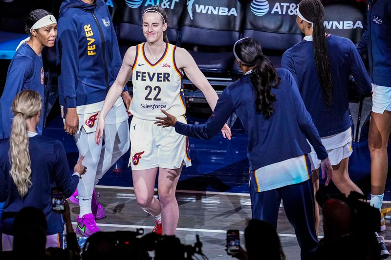 May 24, 2025; Indianapolis, Indiana, USA; Indiana Fever guard Caitlin Clark (22) is introduced before a game between the Indiana Fever and the New York Liberty at Gainbridge Fieldhouse. Mandatory Credit: Grace Smith/USA Today Network via Imagn Images