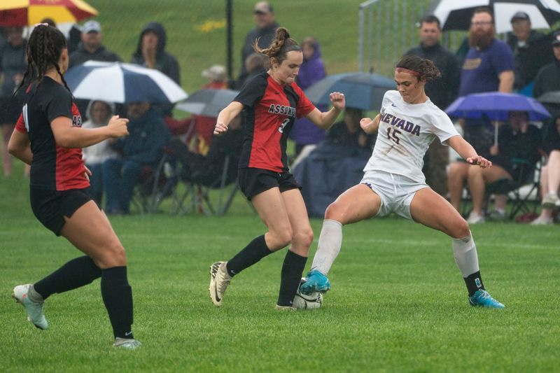 Nevada's Avery Anderson (15) and Davenport Assumption's Katelyn O'Brien (9) battle for the ball during the 2025 IGHSAU state soccer tournament at Lied Recreational Fields on June 3, 2025, in Ames.