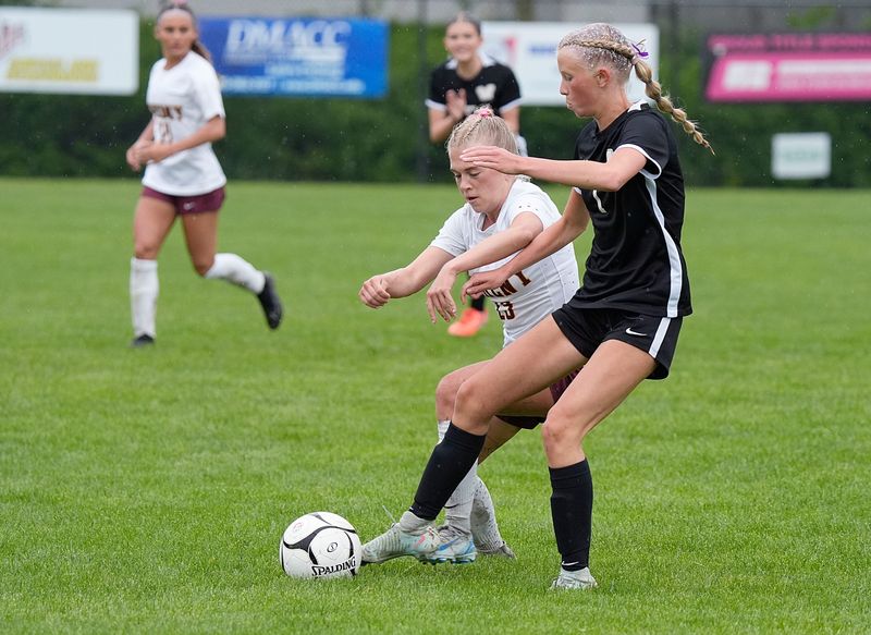 Waukee's Sydney Burrier (1)and Ankeny defender/midfielder Abby Stetich battle for the ball during the first half of the 3A girls Iowa high school soccer quarterfinal at Lied Recreation Athletic Center on June 3, 2025, in Ames, Iowa