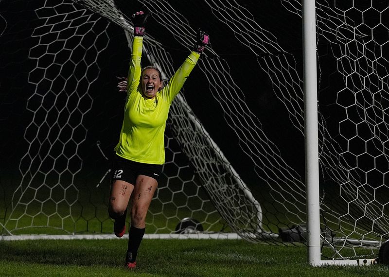 Ankeny Centennial's goalkeeper Emmarie Becker (12) celebrates after a saved a goal during shootout of the 3A girls Iowa high school soccer quarterfinal at Lied Recreation Athletic Center on June 3, 2025, in Ames, Iowa