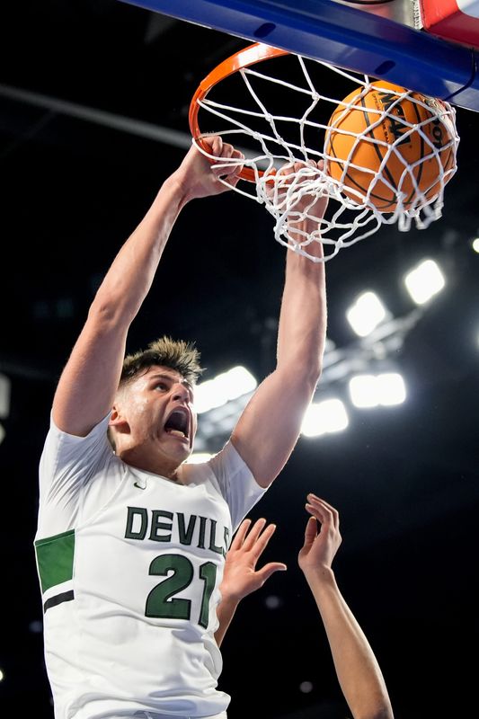 Greeneville's Trey Thompson (21) dunks against Munford during the fourth quarter of a TSSAA Class 3A basketball state quarterfinal game at Murphy Center in Murfreesboro, Tenn., Thursday, March 20, 2025.