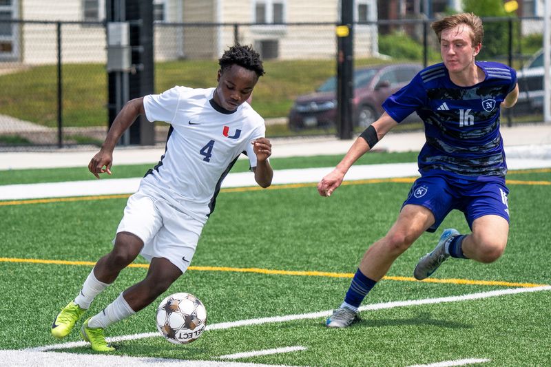 Urbandale's Emmanuel Mauris controls the ball against Norwalk's 	Matthew Lane during the 2025 Iowa high school boys state soccer tournament at Mediacom Stadium on June 5, 2025, in Des Moines.