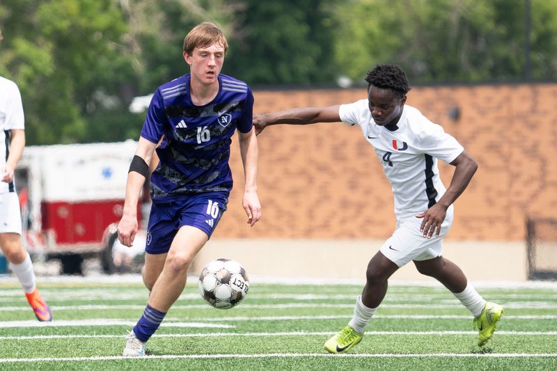 Urbandale's Emmanuel Mauris and Norwalk's Eli Scavo battle for the ball during the 2025 Iowa high school boys state soccer tournament at Mediacom Stadium on June 5, 2025, in Des Moines.
