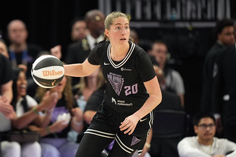 Jun 1, 2025; San Francisco, California, USA; Golden State Valkyries guard Kate Martin (20) dribbles against the Minnesota Lynx during the third quarter at Chase Center. Mandatory Credit: Darren Yamashita-Imagn Images
