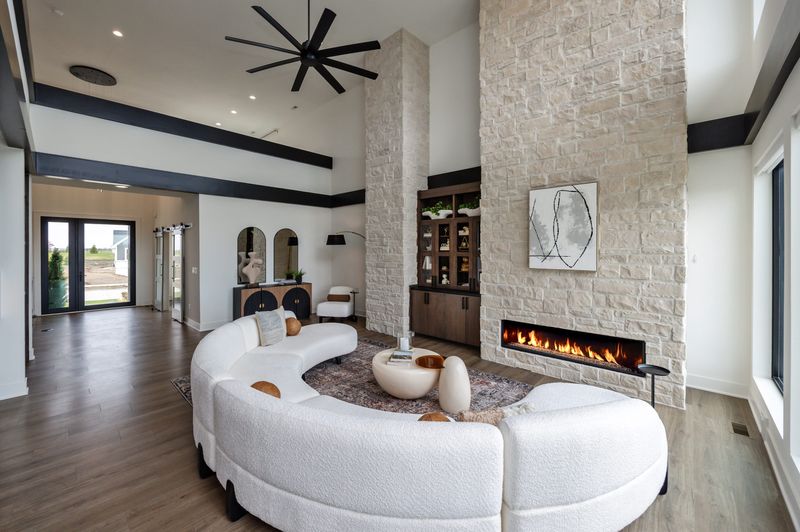 Just in time for summer, a $1.45 million modern home in Ankeny offers a saltwater pool, kegerator bar, and app-controlled shower heads. A fireplace anchors the living room.