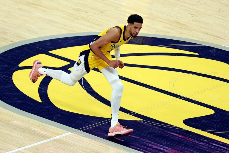 Jun 11, 2025; Indianapolis, Indiana, USA; Indiana Pacers guard Tyrese Haliburton (0) celebrates after a play during the fourth quarter against the Oklahoma City Thunder in game three of the 2025 NBA Finals at Gainbridge Fieldhouse. Mandatory Credit: Trevor Ruszkowski-Imagn Images