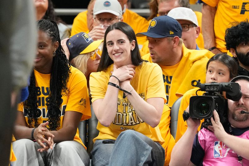 Jun 11, 2025; Indianapolis, Indiana, USA; Caitlin Clark attends game three of the 2025 NBA Finals between the Oklahoma City Thunder and the Indiana Pacers at Gainbridge Fieldhouse. Mandatory Credit: Kyle Terada-Imagn Images