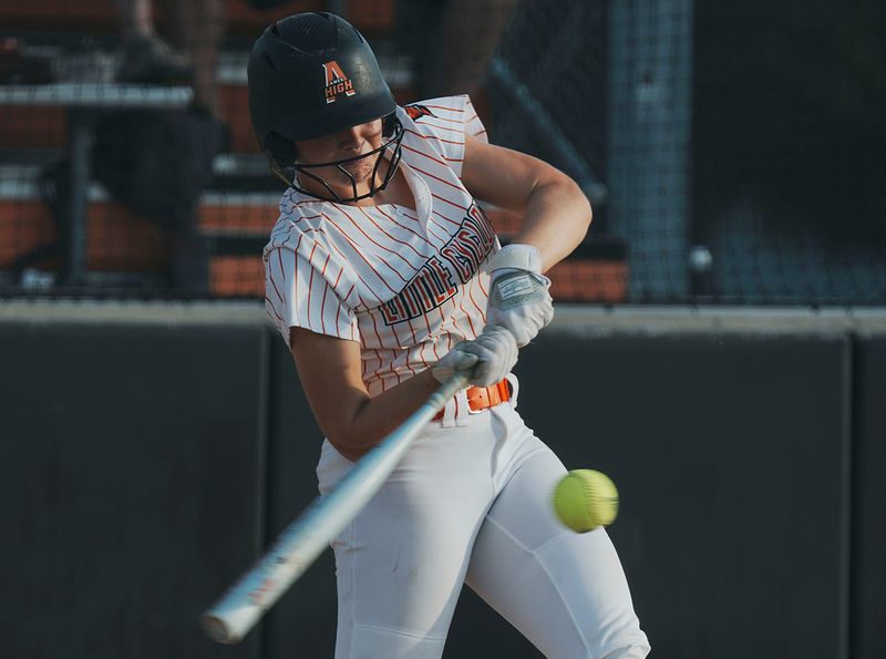 Ames' Mya Geffre (11) hits the ball for a double against Wahlert Catholic during the second inning at Ames Softball Field on June 13, 2026, in Ames, Iowa.