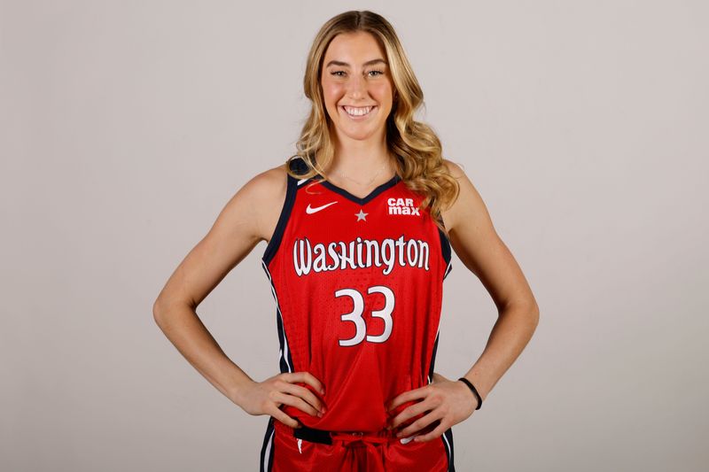Apr 28, 2025; Washington, DC, USA; Washington Mystics guard Lucy Olsen (33) poses for a portrait during Mystics Media Day at CareFirst Arena. Mandatory Credit: Geoff Burke-Imagn Images